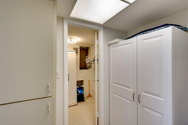 hallway featuring a textured ceiling