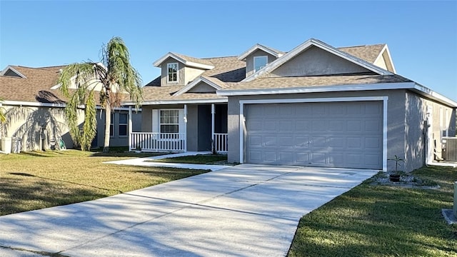 view of front of property with a front yard, a porch, and a garage