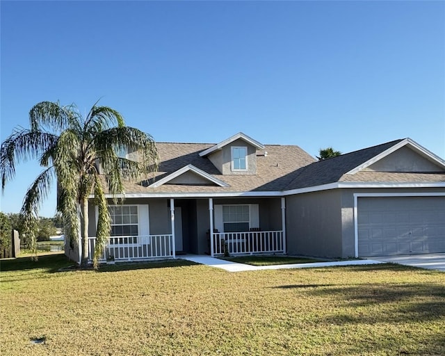 view of front facade with a front lawn, a porch, and a garage