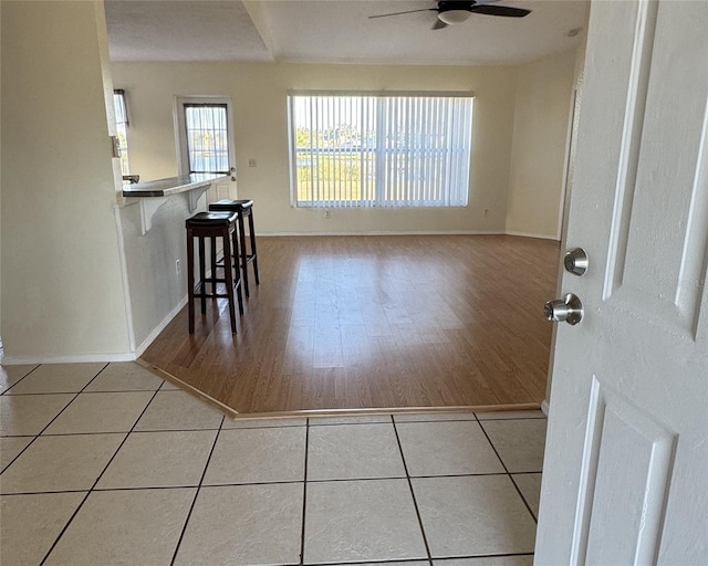 4042 Kingsfield Dr, Parrish, FL 34219 - tiled dining area featuring ceiling fan and baseboards