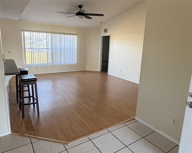 4042 Kingsfield Dr, Parrish, FL 34219 - living room with ceiling fan, wood finished floors, vaulted ceiling, and baseboards