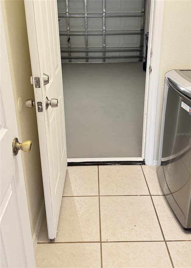 washroom featuring washer / clothes dryer and tile patterned flooring