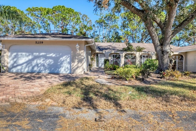 single story home featuring a garage