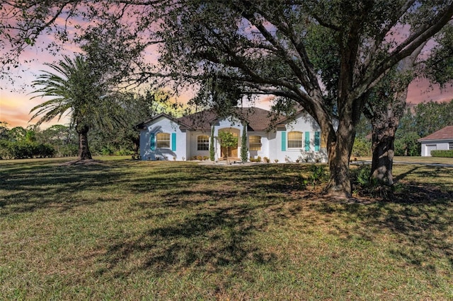 view of front of house with a lawn