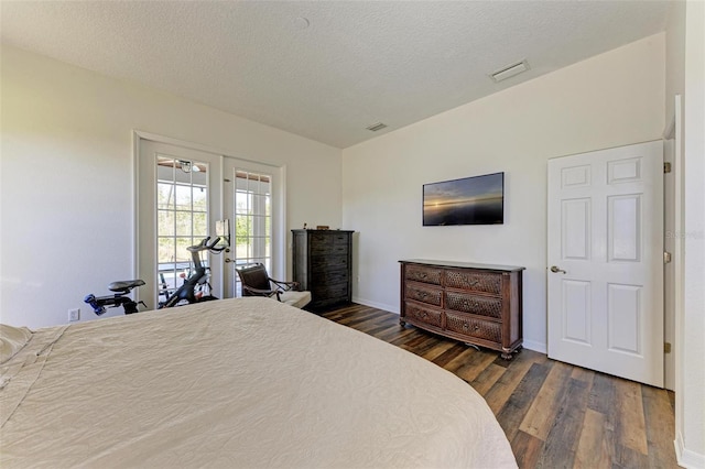 21709 Deer Pointe Xing, Bradenton, FL 34202 - bedroom with dark wood-style flooring and a textured ceiling
