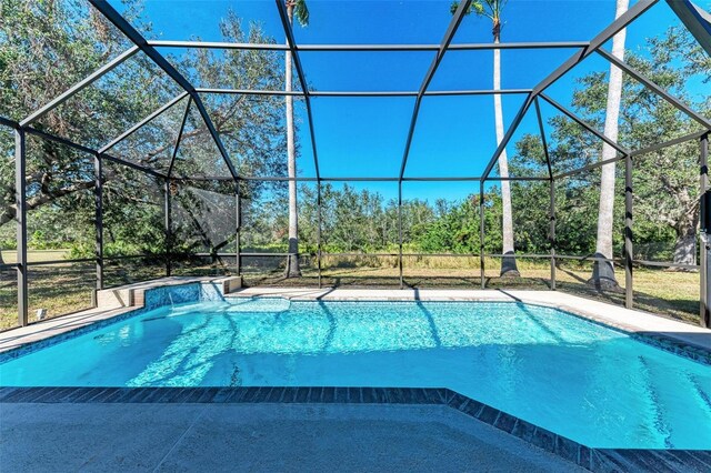21709 Deer Pointe Xing, Bradenton, FL 34202 - swimming pool with a lanai and view of wooded area