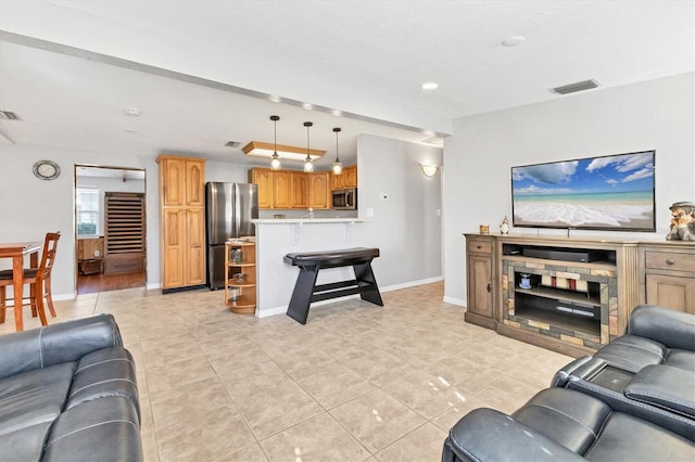 living room with light tile patterned floors