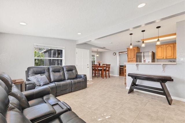 living room featuring light tile patterned floors and vaulted ceiling with beams