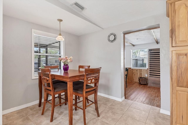 dining room featuring light hardwood / wood-style floors and a healthy amount of sunlight