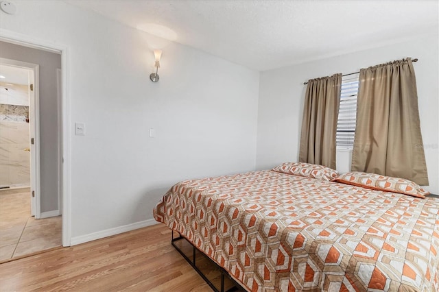 bedroom featuring light wood-type flooring