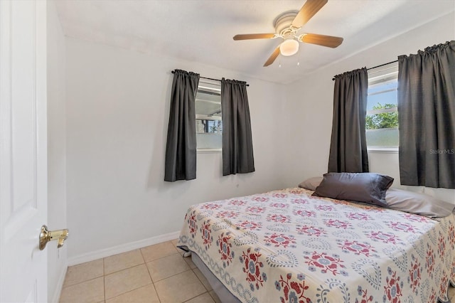 tiled bedroom with ceiling fan