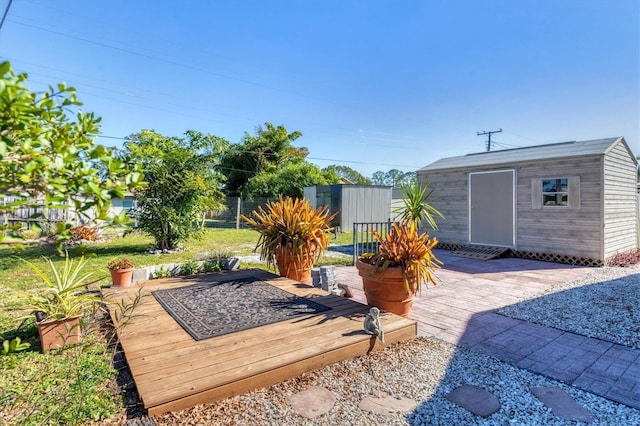 view of yard featuring a storage unit and a patio