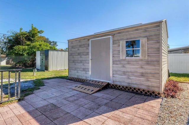 view of outbuilding featuring a yard