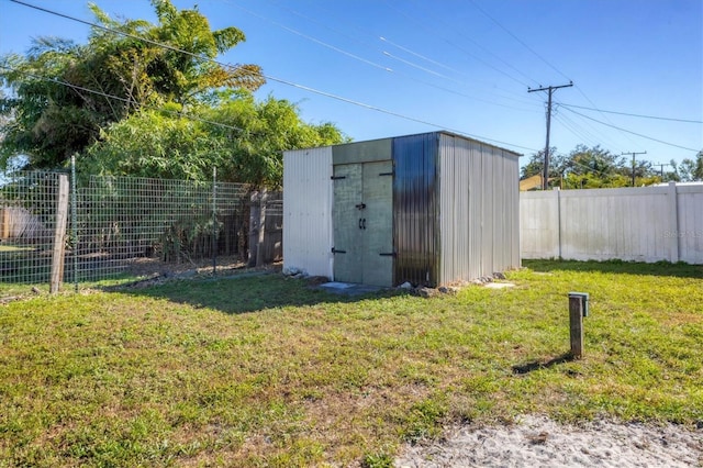 view of outdoor structure featuring a lawn