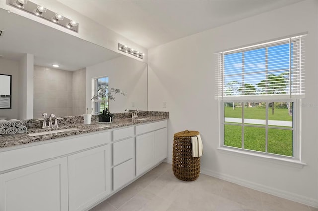 bathroom featuring tile patterned floors and vanity