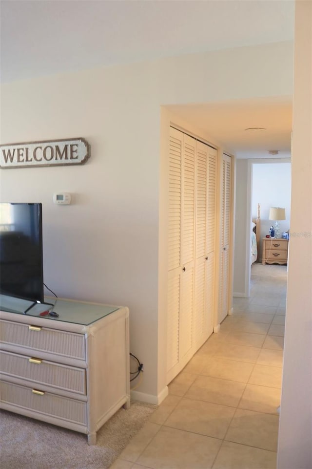 hallway with light tile patterned flooring