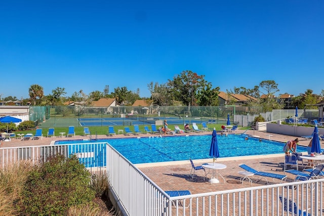 view of swimming pool with a patio