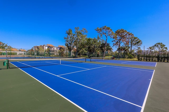 view of sport court with basketball hoop