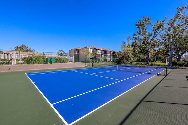 view of sport court featuring basketball hoop