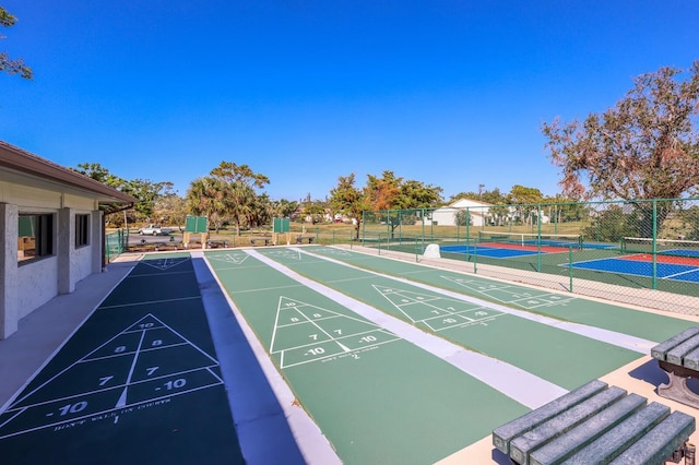 view of community with tennis court