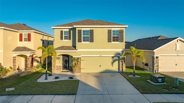 view of front of home featuring a front yard and a garage