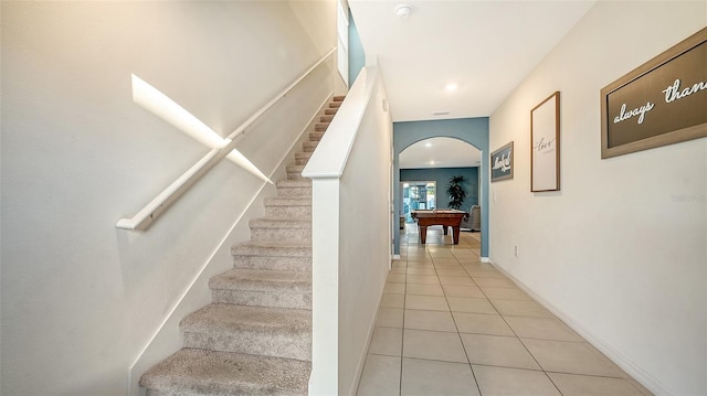 stairway with tile patterned floors and billiards