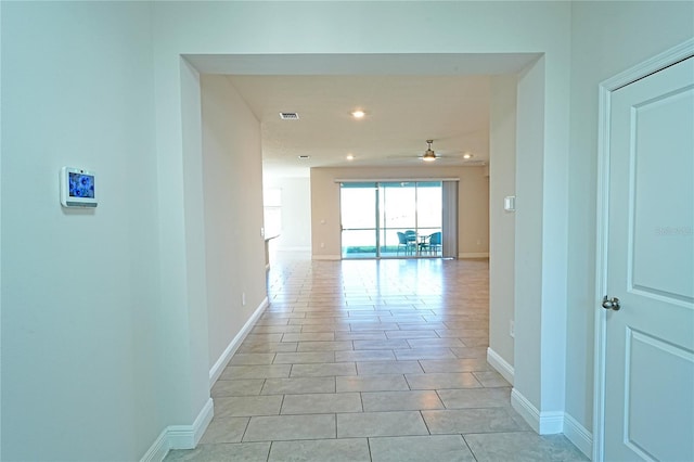 hallway featuring light tile patterned floors