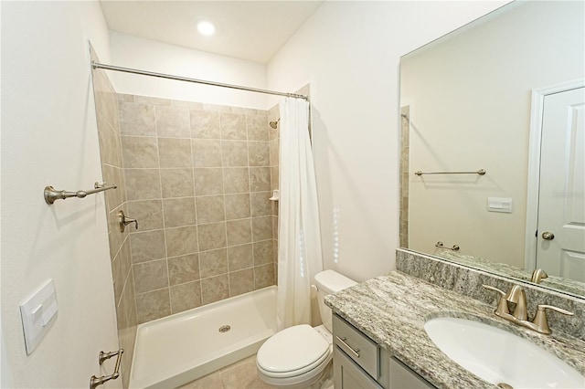 bathroom featuring a shower with shower curtain, vanity, and toilet