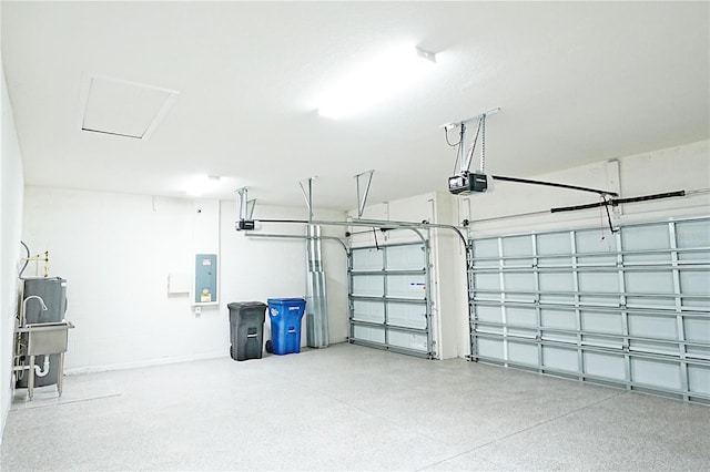 garage featuring electric panel and a garage door opener