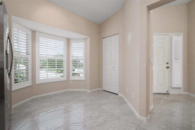 foyer entrance with lofted ceiling