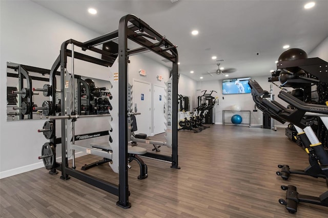 workout area featuring hardwood / wood-style flooring and ceiling fan