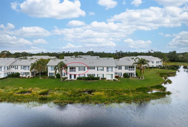 drone / aerial view with a water view