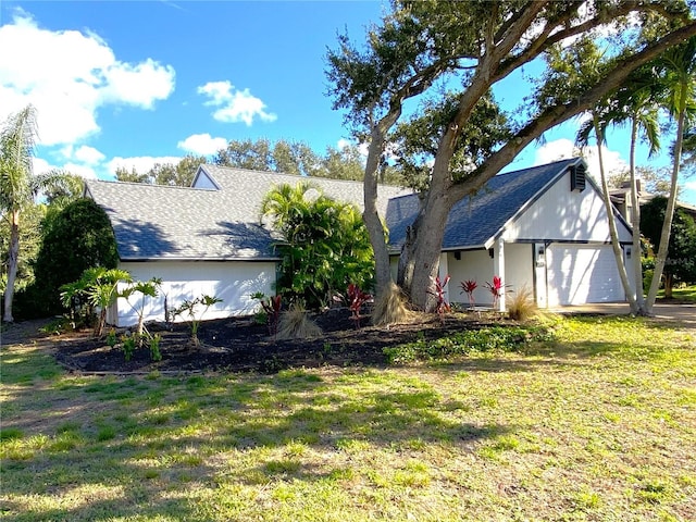 exterior space featuring a front yard and a garage