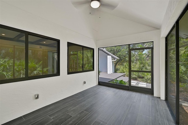 unfurnished sunroom featuring lofted ceiling and ceiling fan