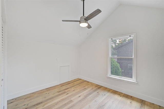 additional living space featuring ceiling fan, vaulted ceiling, and light wood-type flooring