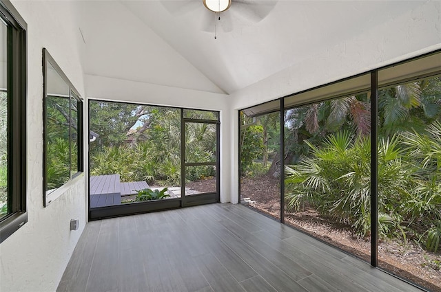 unfurnished sunroom featuring vaulted ceiling and ceiling fan