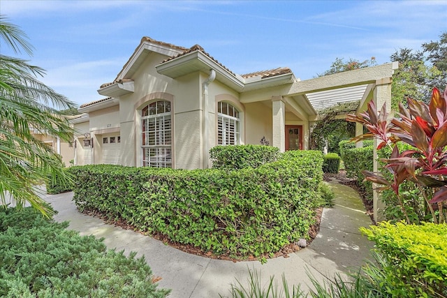 view of side of home with a garage