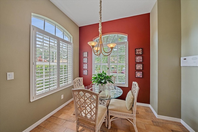 dining room featuring a wealth of natural light and a chandelier