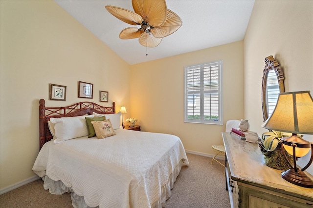 bedroom featuring light carpet, vaulted ceiling, and ceiling fan