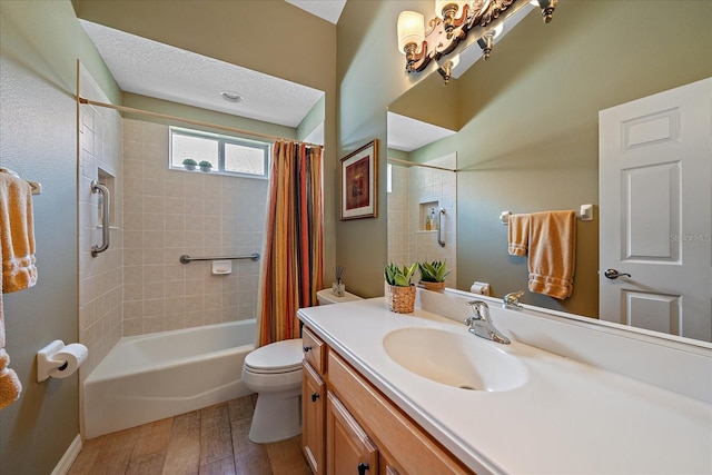 full bathroom with shower / bath combo, vanity, toilet, a textured ceiling, and wood-type flooring