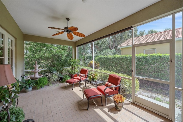 sunroom / solarium with ceiling fan