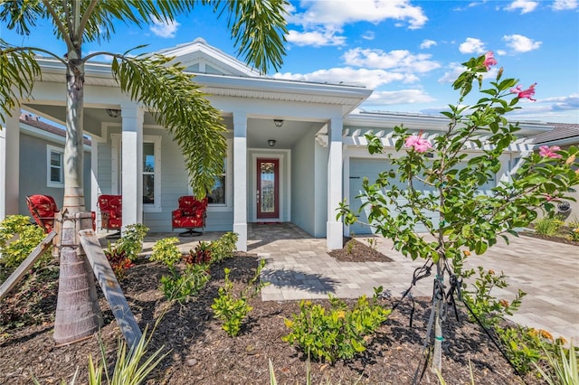 doorway to property with a garage