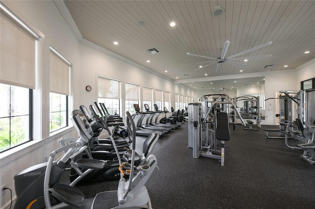 gym featuring ceiling fan, crown molding, and wood ceiling