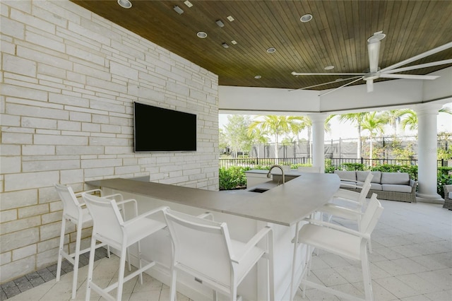 exterior space featuring a gazebo, ceiling fan, and an outdoor wet bar