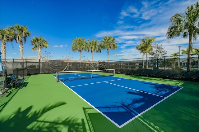 view of tennis court featuring basketball court