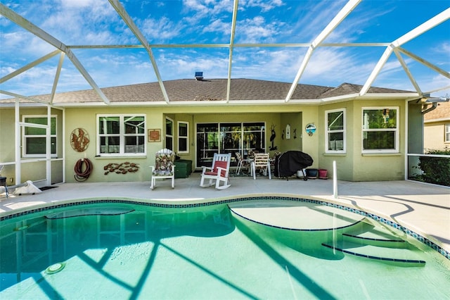 view of pool with a patio and a lanai