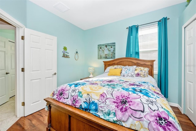 bedroom with light hardwood / wood-style floors