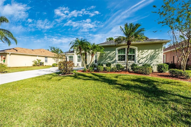 ranch-style home with a front lawn