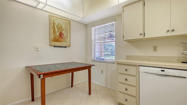 kitchen with dishwasher and light tile patterned flooring