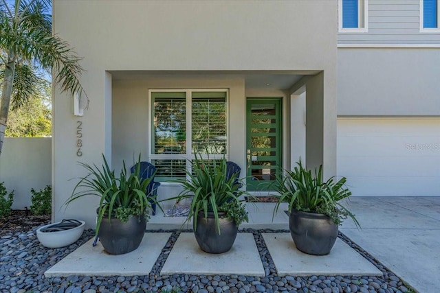 doorway to property featuring a garage